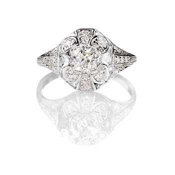 Antique-style diamond ring with intricate metalwork