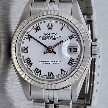 Luxury watch close-up showing a branded dial